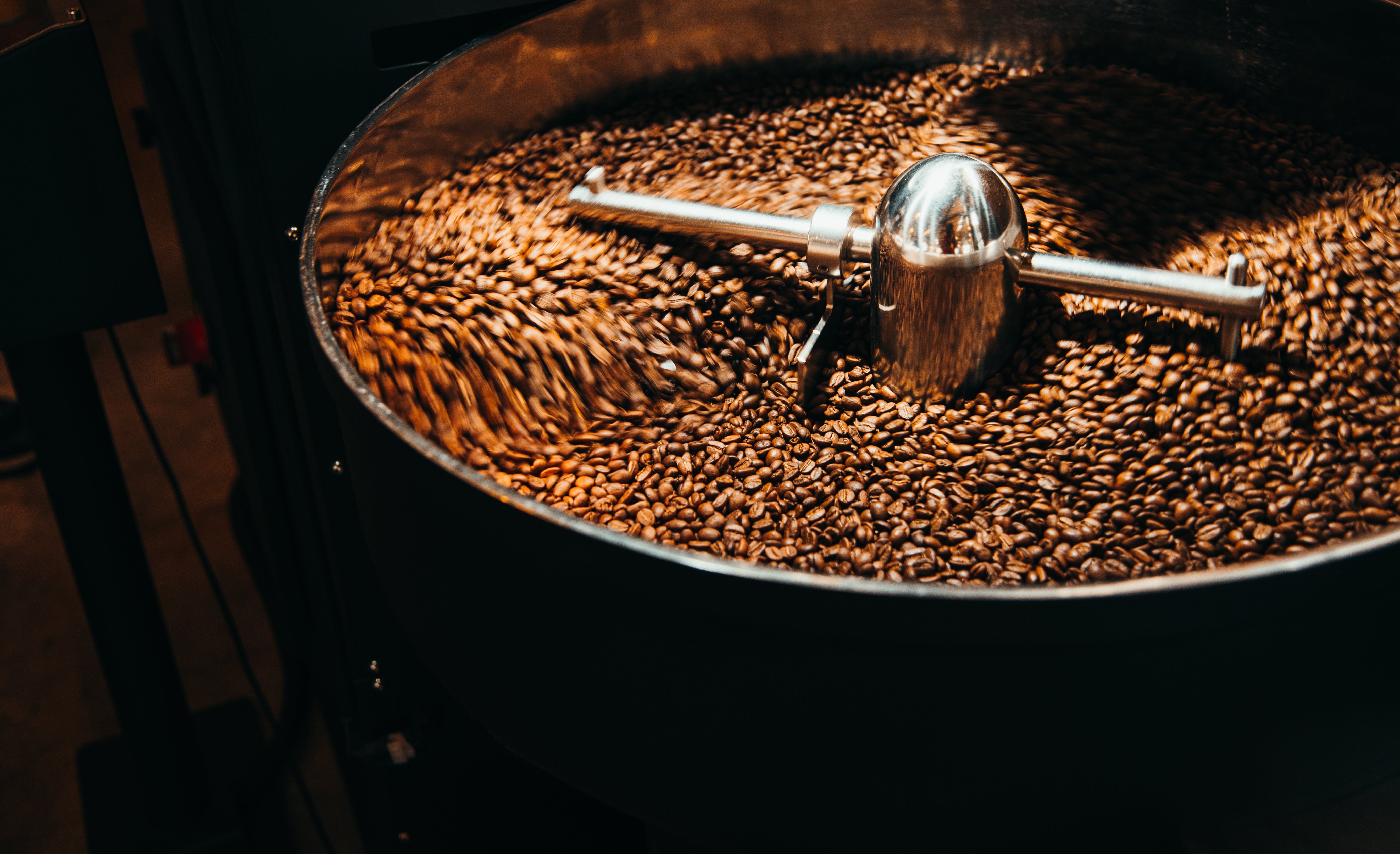 Coffee beans being roasted in a machine